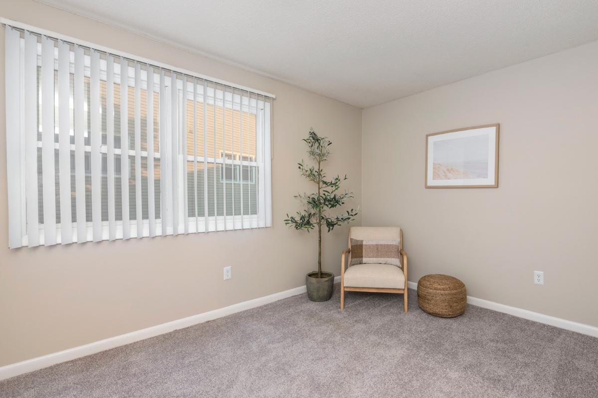 Bedrooms feature large windows allowing ample sunlight to shine through.