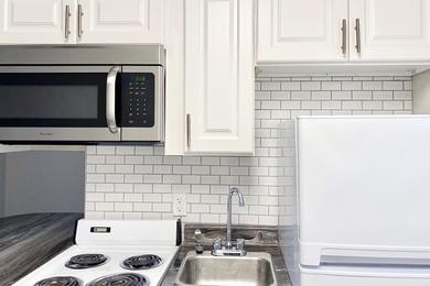 White Subway Tile Backsplash | All apartments feature a white subway tile backsplash in the kitchen.