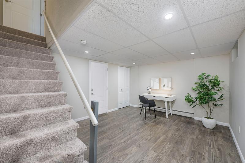 Finished Basement | Select floor plans offer a finished basement with wood-style flooring.