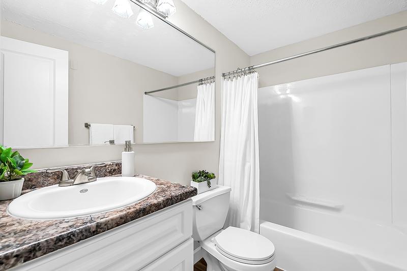 Bathroom | Modern style bathrooms featuring large mirrors.