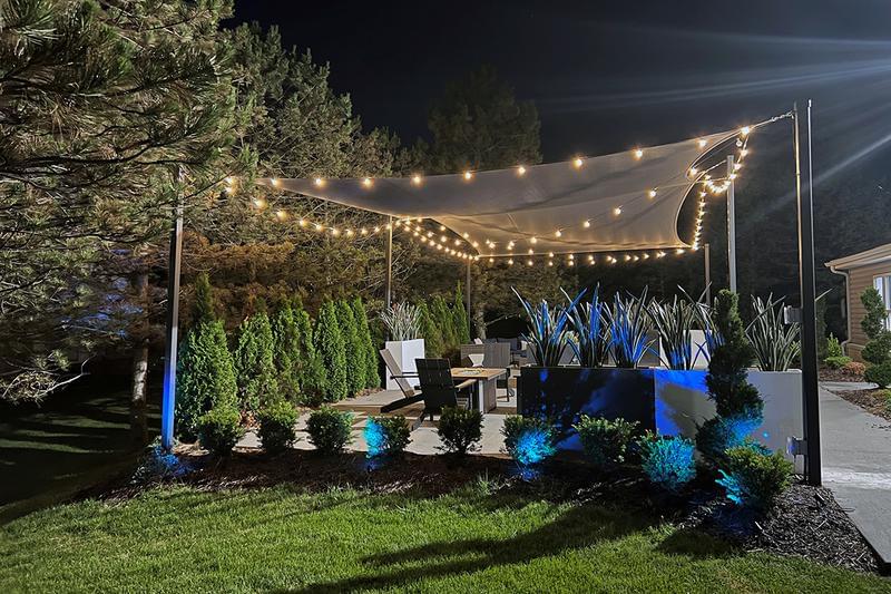 Outdoor Lounge at Night | Relax at the outdoor lounge at night under the bistro lighting.