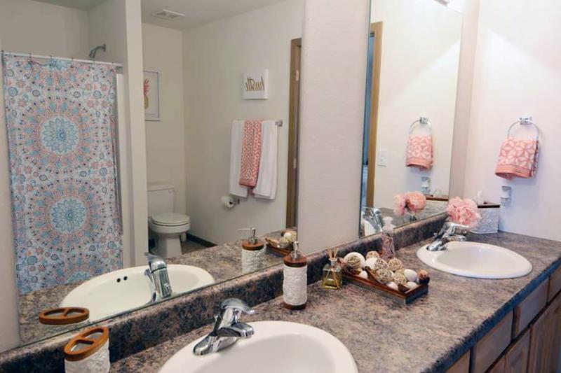 Bathroom | Our bathrooms feature oversized vanities, large mirrors and an abundance of cabinet space for you and your roommate.