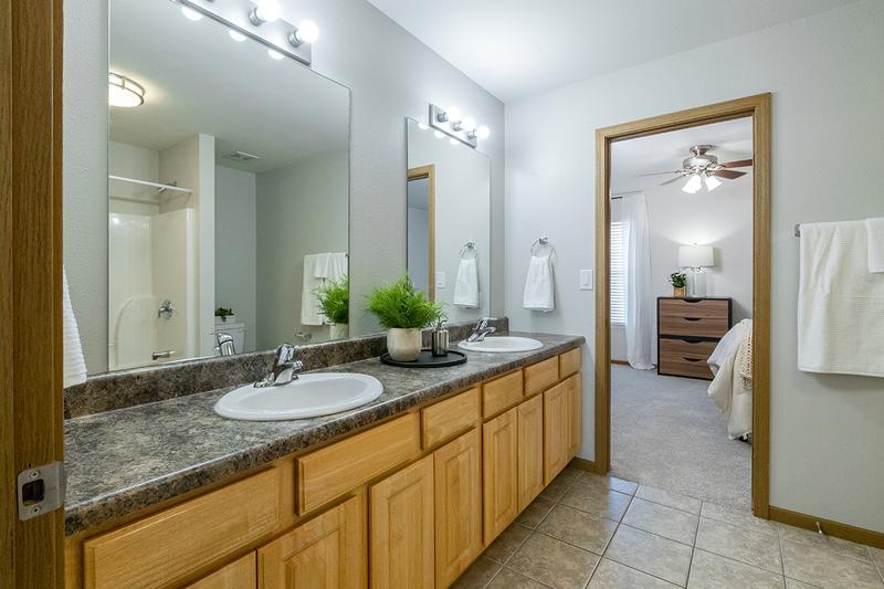 Shared and Private Bathrooms | Bathrooms featuring expansive countertops, large mirrors and ample cabinetry for your storage needs.