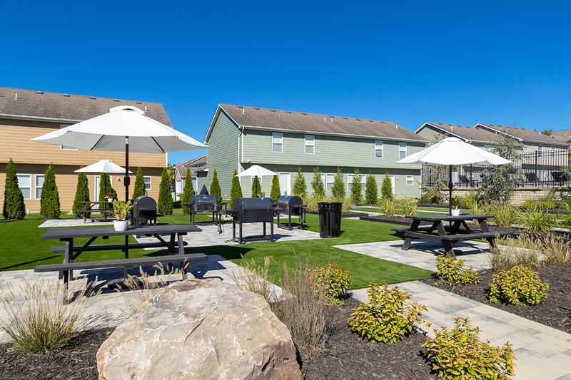 Picnic Area | The Row features a large picnic area featuring grilling stations and picnic tables with umbrellas.