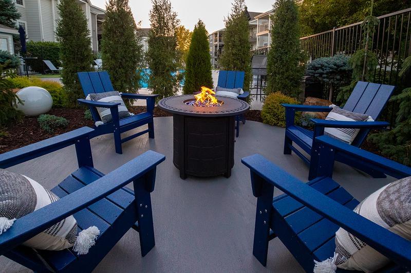 Poolside Fire Pit | Wind down and relax by our fire pit by the pool.