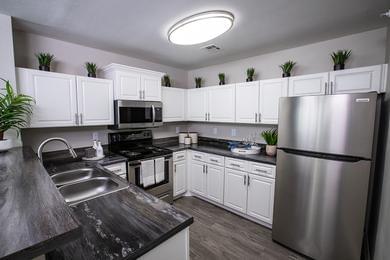 Stainless Steel Appliances | Updated kitchens feature stainless steel appliances and wood-style flooring.