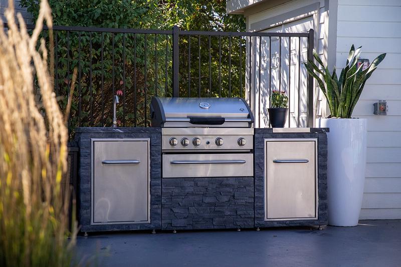 Outdoor Kitchen | Cookout by the pool utilizing our outdoor kitchen featuring a gas grill.