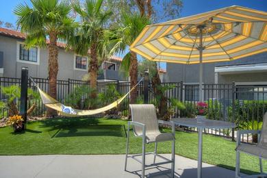 Hammocks | Lay out and soak in the sun from our poolside hammocks.