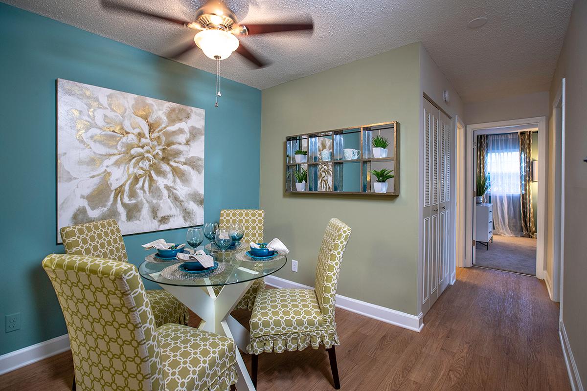 Separate dining area with a ceiling fan.