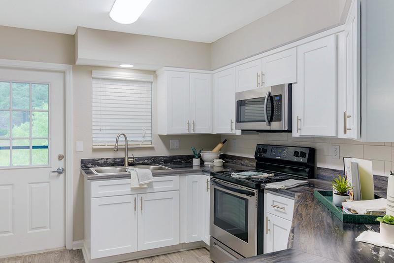 Stainless Steel Appliances | Our open layout kitchens include stainless steel appliances; refrigerator, stove, dishwasher and microwave.