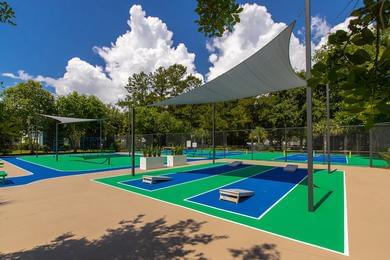 Outdoor Recreation Area | Emerson Isles offers plenty of outdoor recreation including cornhole, pickleball courts, an outdoor fit zone, and a putting green.
