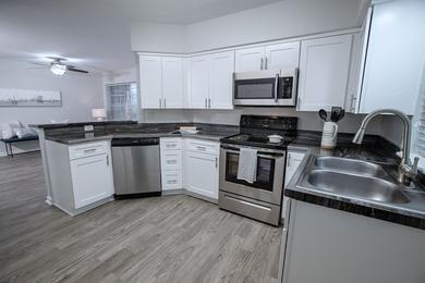 Renovated Kitchens | Emerson Isles has two renovated styles of kitchens with an open concept featuring stainless steel appliances and a breakfast bar overlooking the dining and living areas.