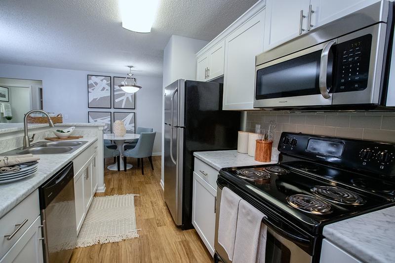 Stainless Steel Appliances | Kitchens feature stainless steel appliances including a dishwasher, microwave, stove and refrigerator - everything you need!
