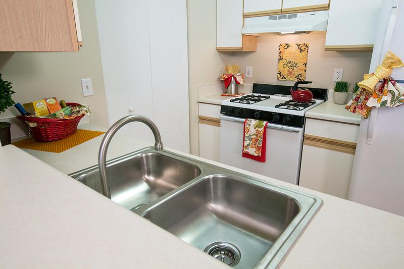 Open Kitchens | We are excited to offer in-person tours while following social distancing and we encourage all visitors to wear a face covering. Kitchens featuring tile flooring, ample cabinetry, and a breakfast bar.