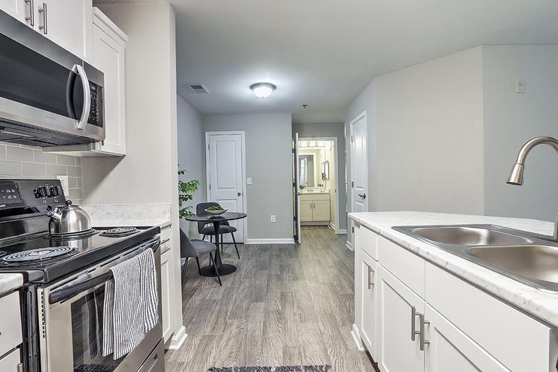 Separate Dining Area | A dining space with additional storage closets is situated close to your fully equipped kitchen.