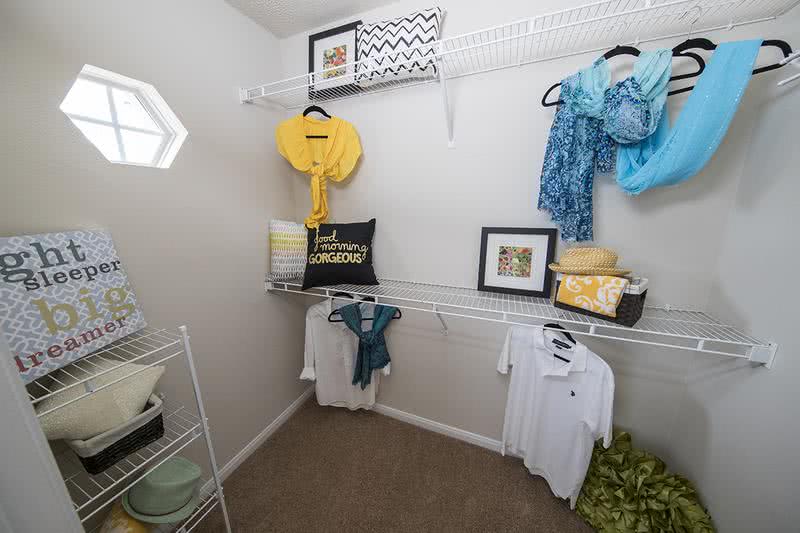 Master Bedroom Closet | The Master suite walk-in closet is everyone's dream,featuring  plenty of space for hanging, shelving for folded items, and storage!