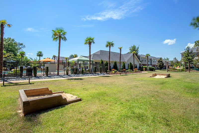 Behind Clubhouse | Behind our clubhouse, you will find our hammock garden as well as cornhole and horseshoes set up to play.