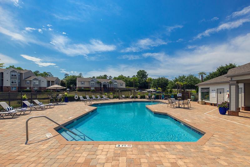 Expansive Sundeck | Lay out and relax on our expansive sundeck on one of the poolside loungers.