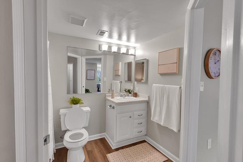 Bathroom | Newly renovated bathrooms with large mirrors and updated counter tops and cabinetry