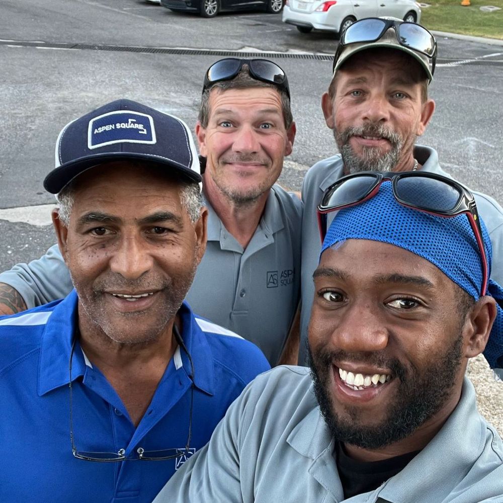 A selfie of four Aspen Square maintenance team members. 
