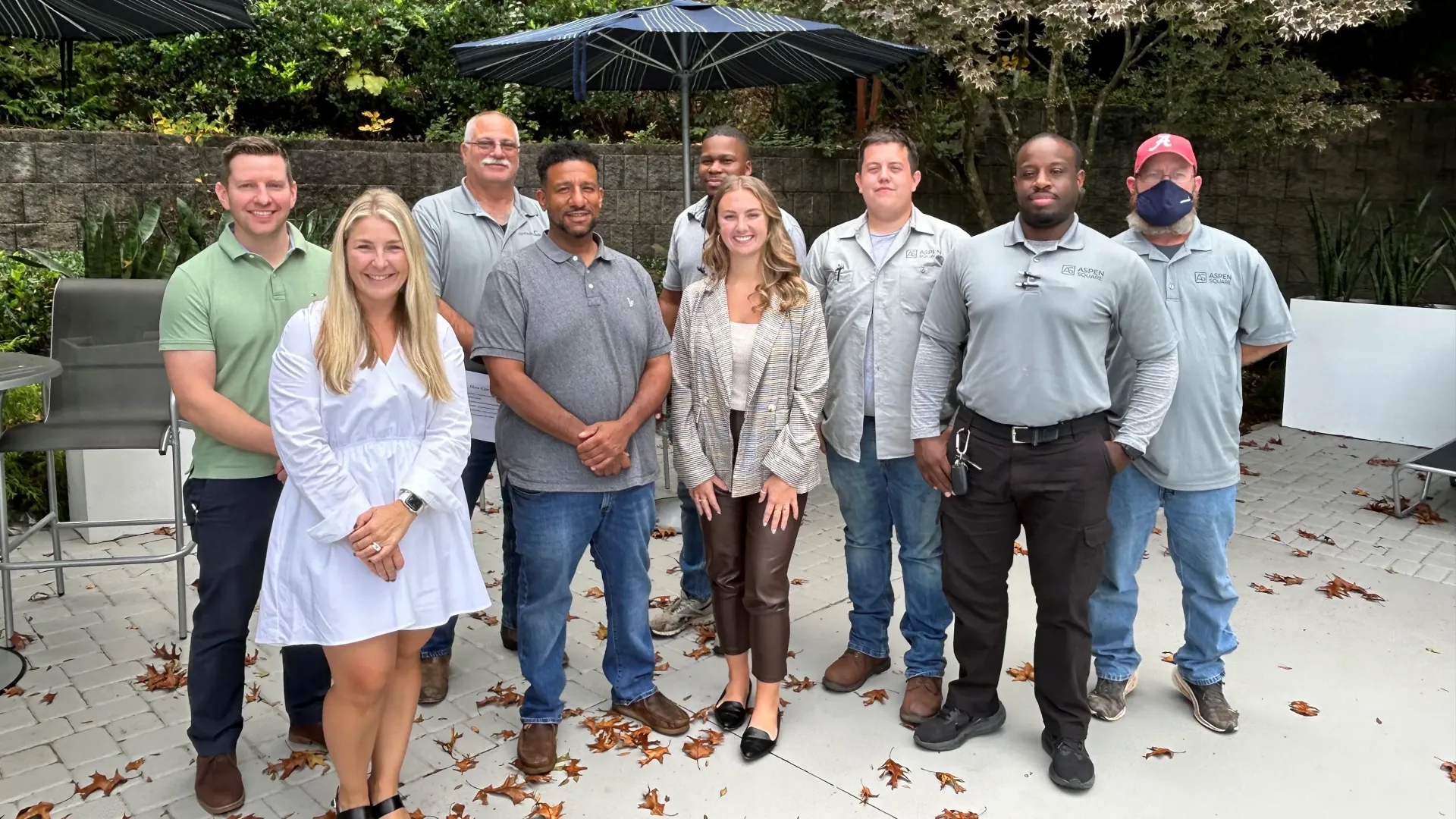 A group of maintenance workers and two members of our recruiting team pose for a photo together after their Recruiting Operations Training session.