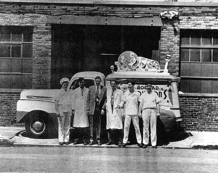 Harold Grinspoon and friends standing in front of a Howard Johnson ice cream truck. 