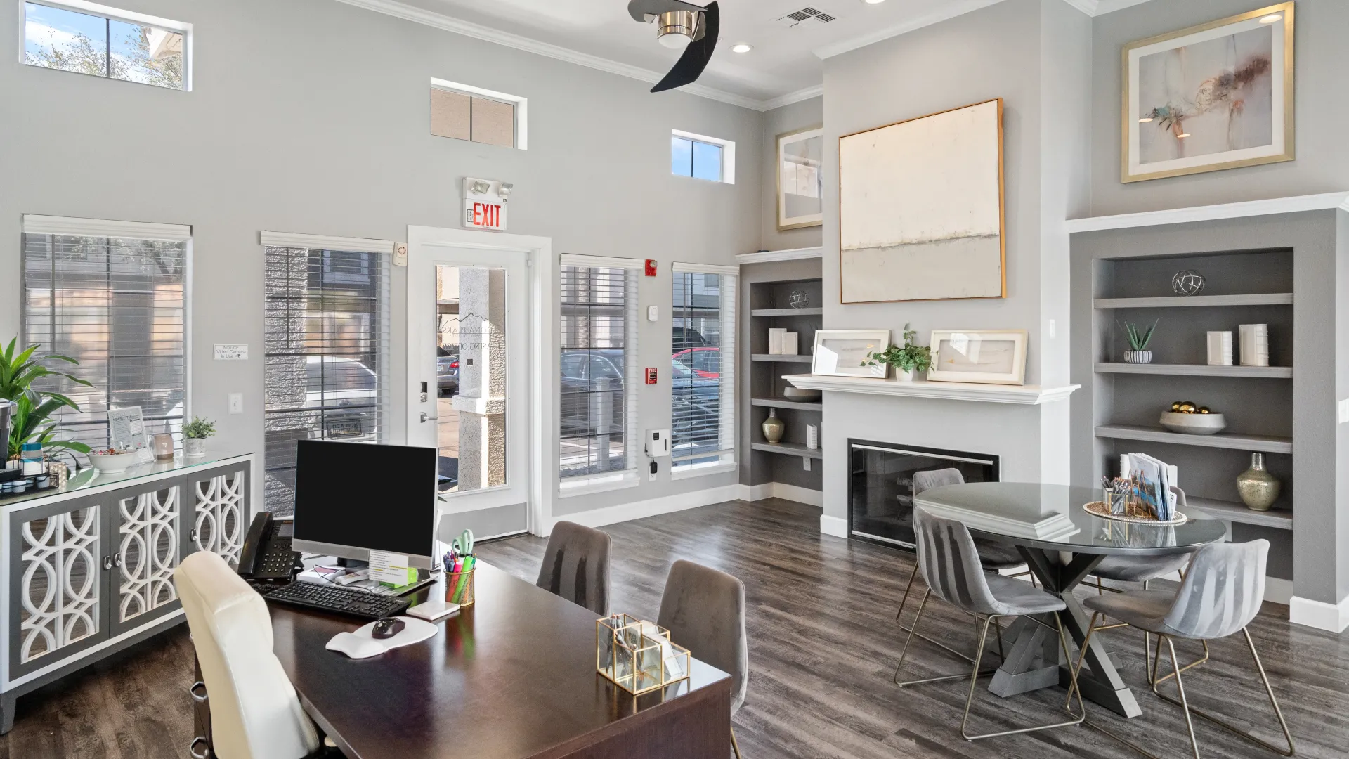 Interior of the leasing office at Sedona Peaks, featuring modern furnishings, a fireplace, and a welcoming workspace.