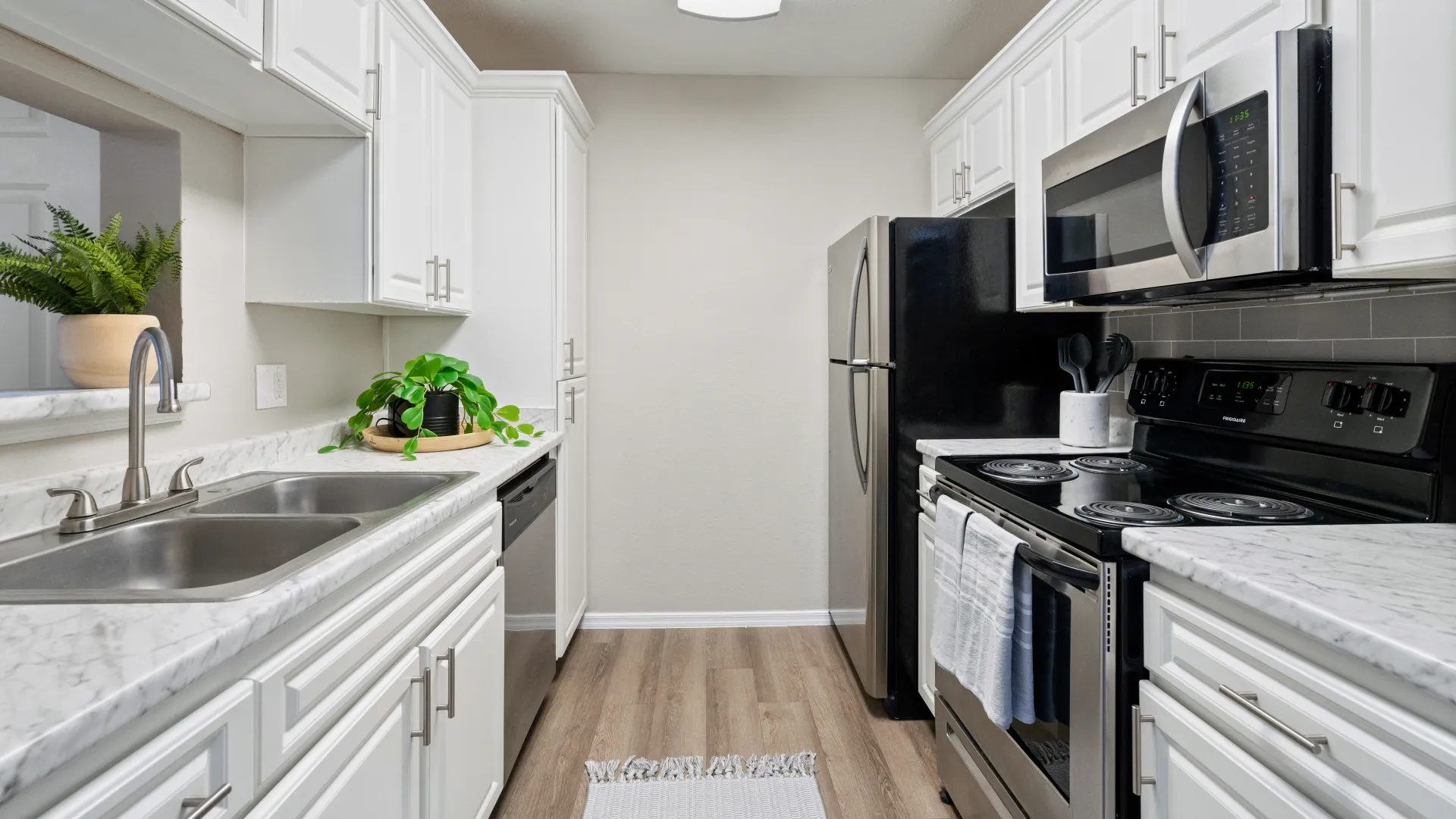 Contemporary kitchen featuring a sleek design, updated fixtures, and a spacious cooking area.