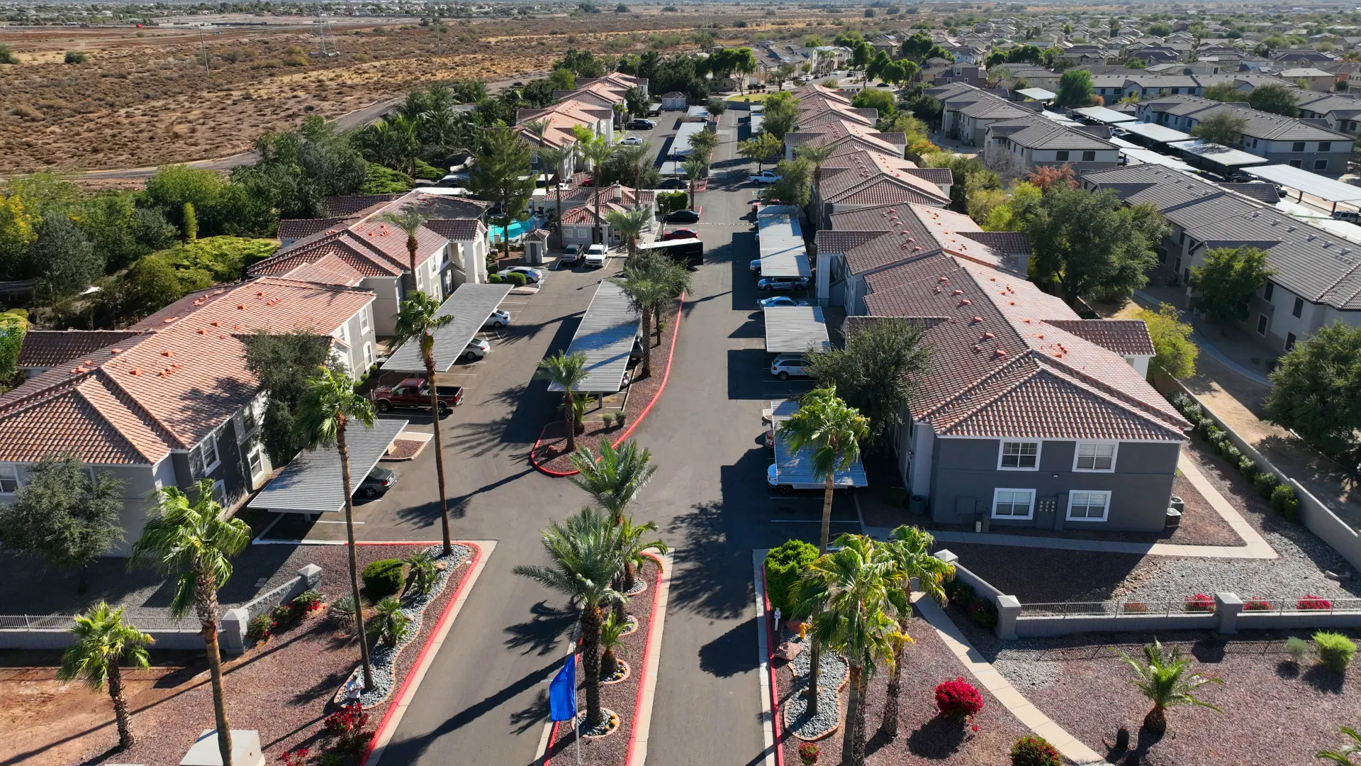 An aerial view of the property, with mountains in the backdrop.