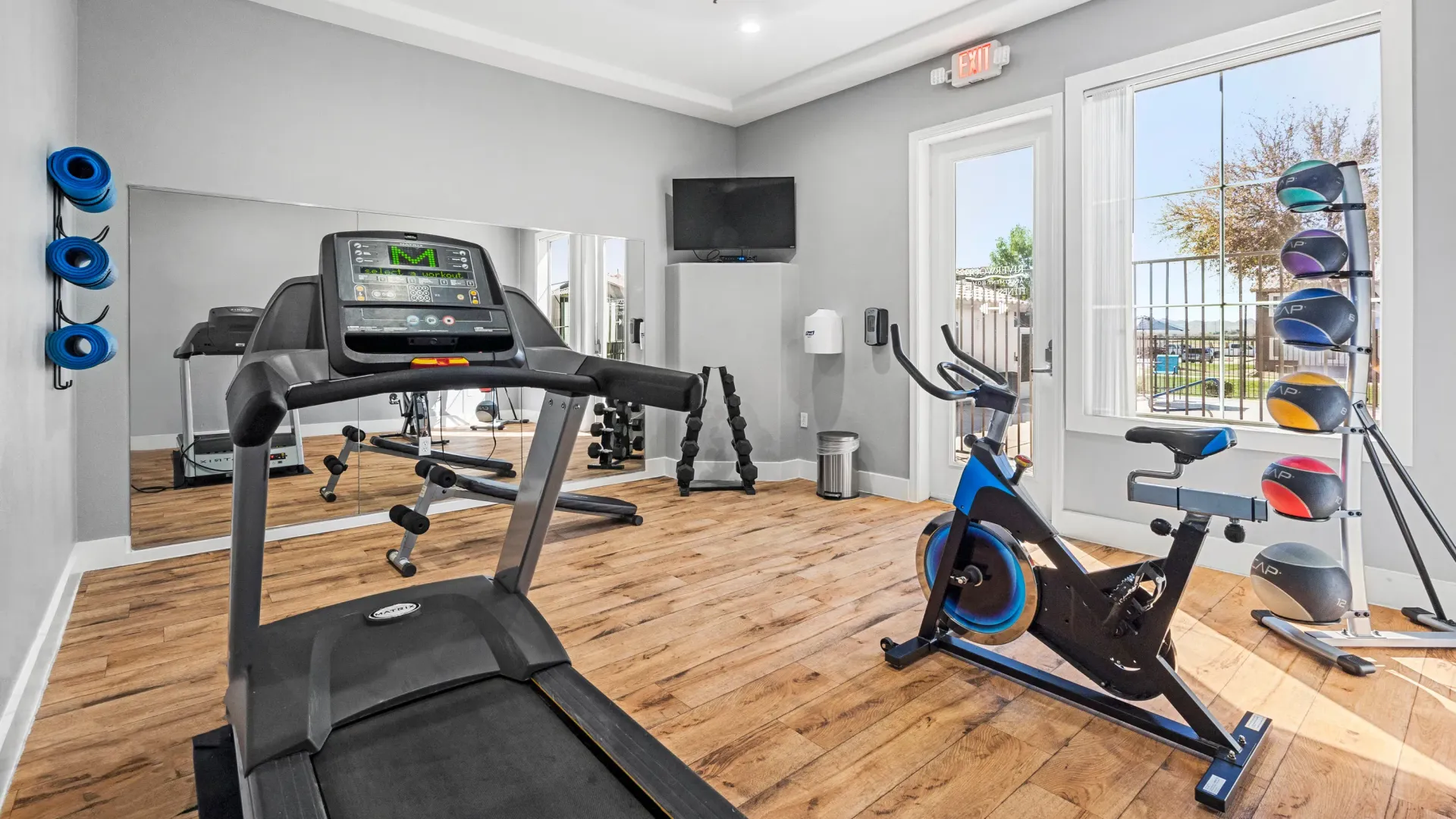 The fitness center boasts a colossal exercise mirror and top-tier equipment