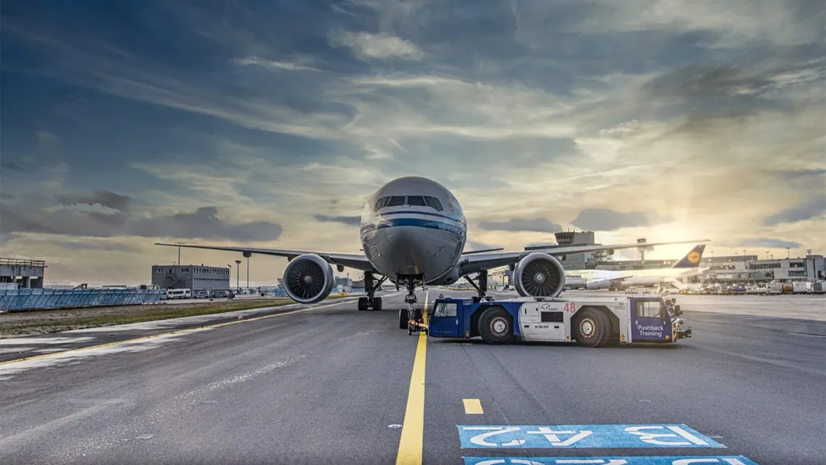 An airplane on a tarmac of an airport