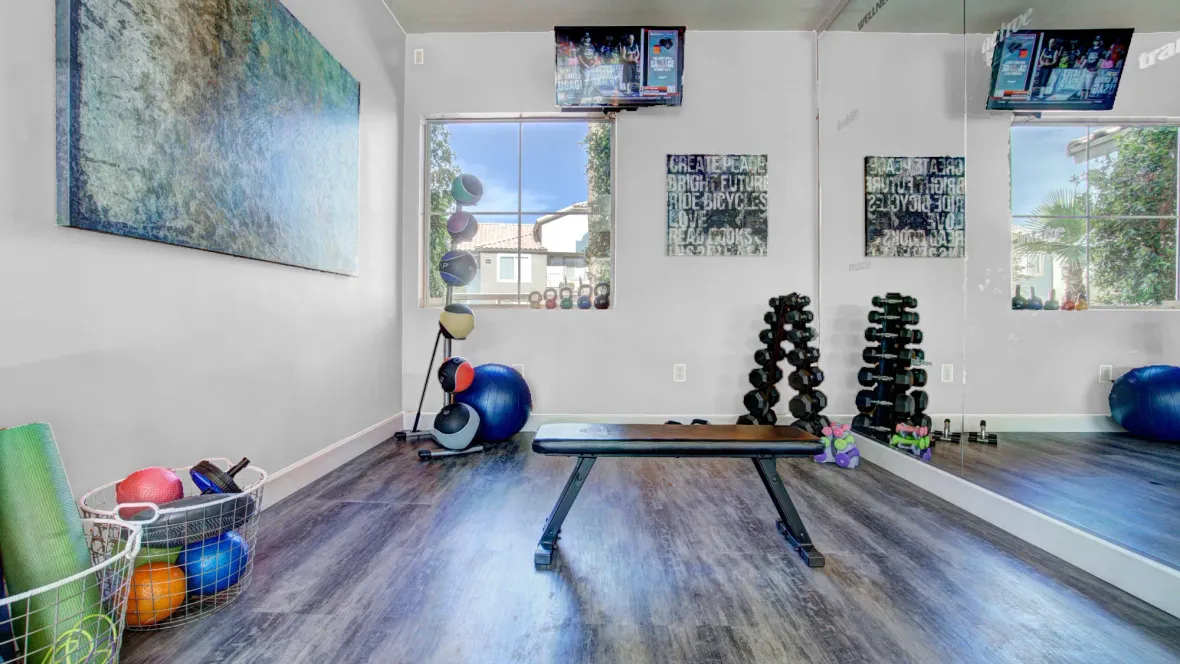 A dedicated space for yoga and stretching, complete with yoga mats and weights to elevate your practice. A floor to ceiling exercise mirror adds a touch of refinement to complete the studio. 