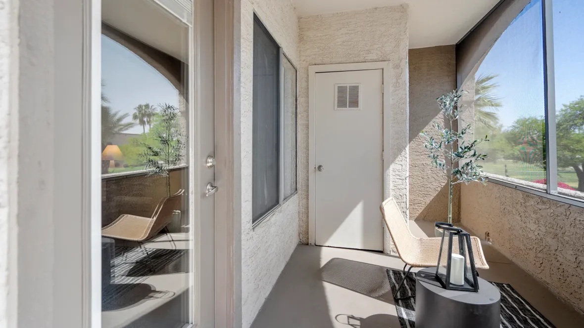 A generously sized screened-in private patio, an extension of the living room, with a useful laundry closet.