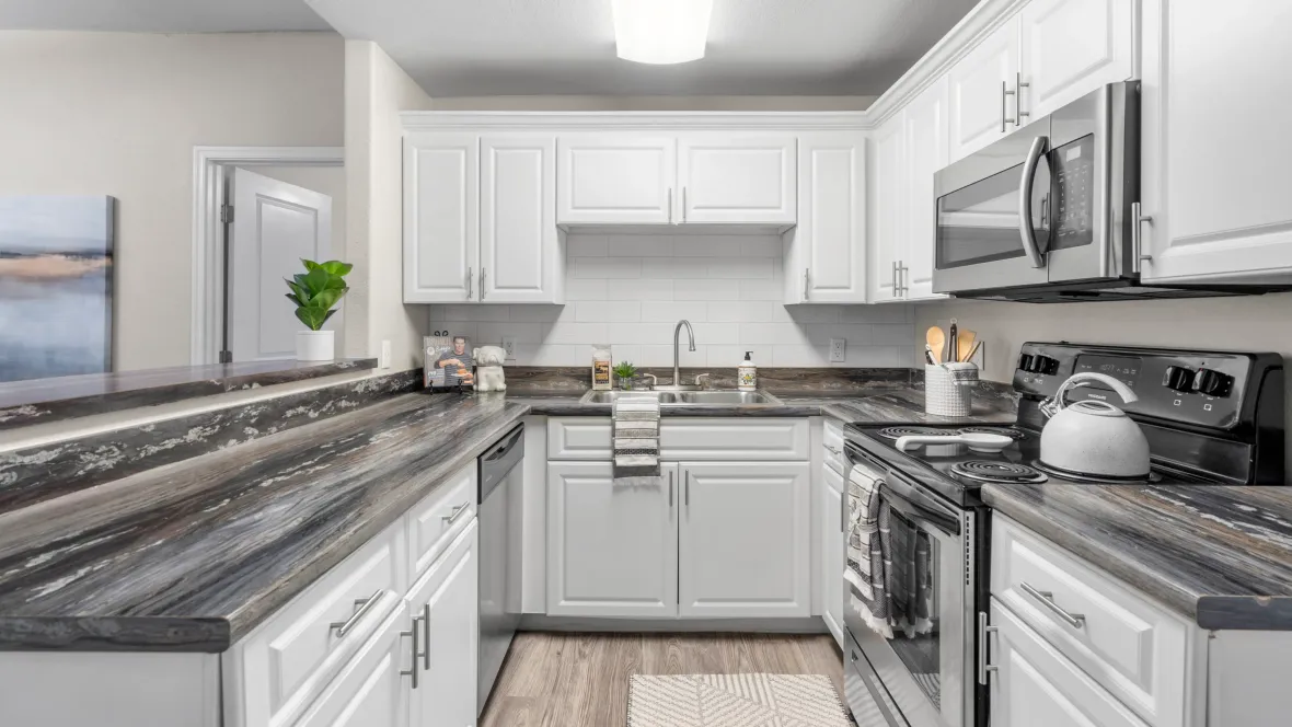 Shine bright with stainless-steel wonders, including the coveted dishwasher, in a spacious U-shaped kitchen.