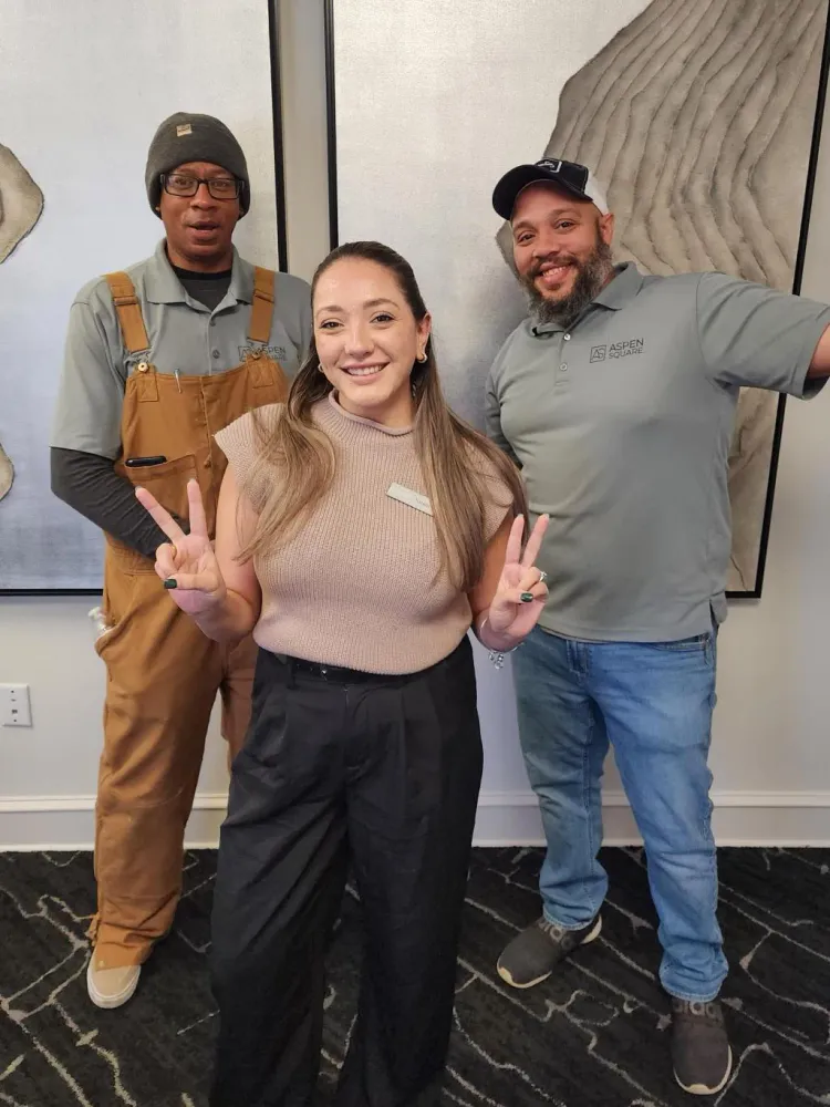 Rowan Park team photo featuring two maintenance technicians and a leasing agent.