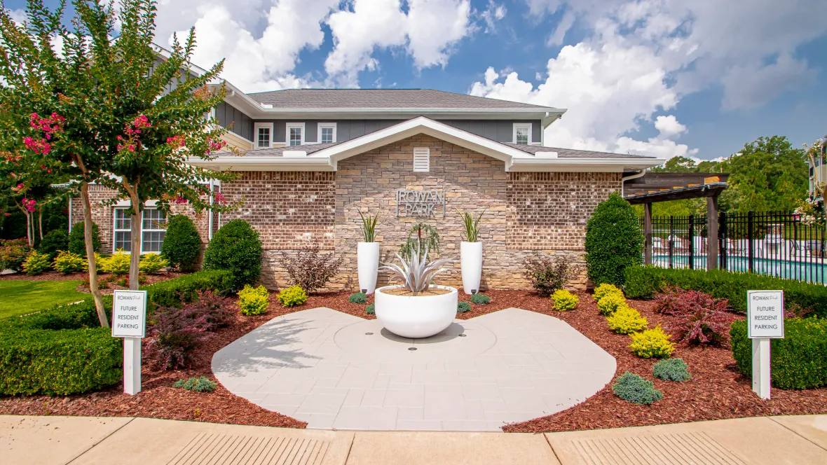 A tantalizing view of the Rowan Park Clubhouse exterior, cocooned by meticulously landscaped grounds.