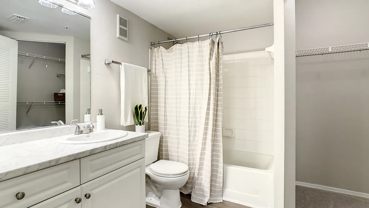A large and bright master bathroom offering abundant storage options is pure delight in apartment living. 