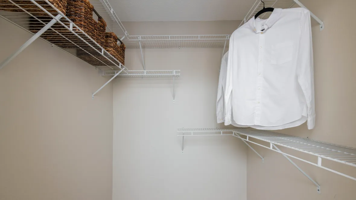 A deep walk-in closet equipped with convenient organizers, ensuring ample storage space for all your needs.