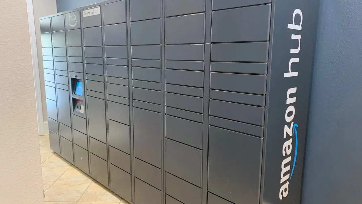A larger Amazon Hub brand package locker with multiple sized package lockers for twenty-four-hour package pick up.