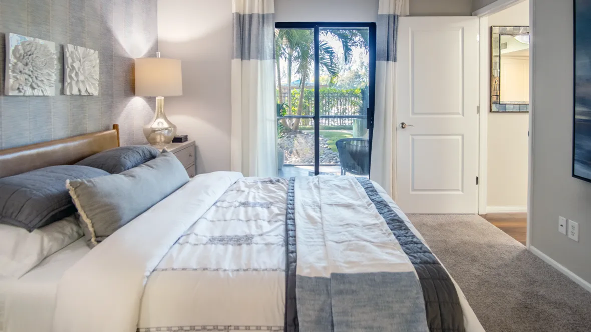 A direct entrance from the bedroom to a private patio, providing an elite outdoor escape – a perk of the Riviera floor plan.