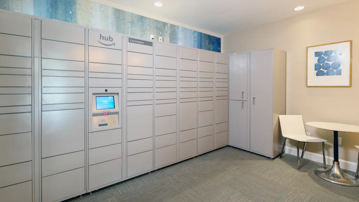 A wall of Amazon lockers located indoors inside the business center, designed for the ultimate ease of our cherished residents for package retrieval.
