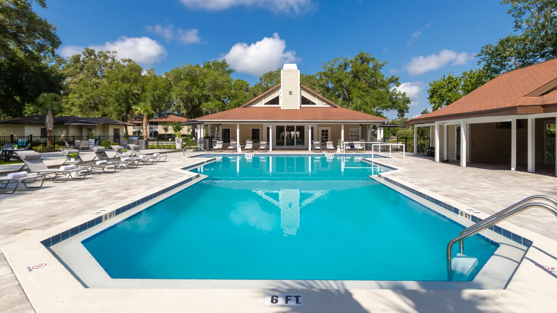 A sparkling pool awaits, inviting you to take a refreshing plunge and escape the Florida heat.