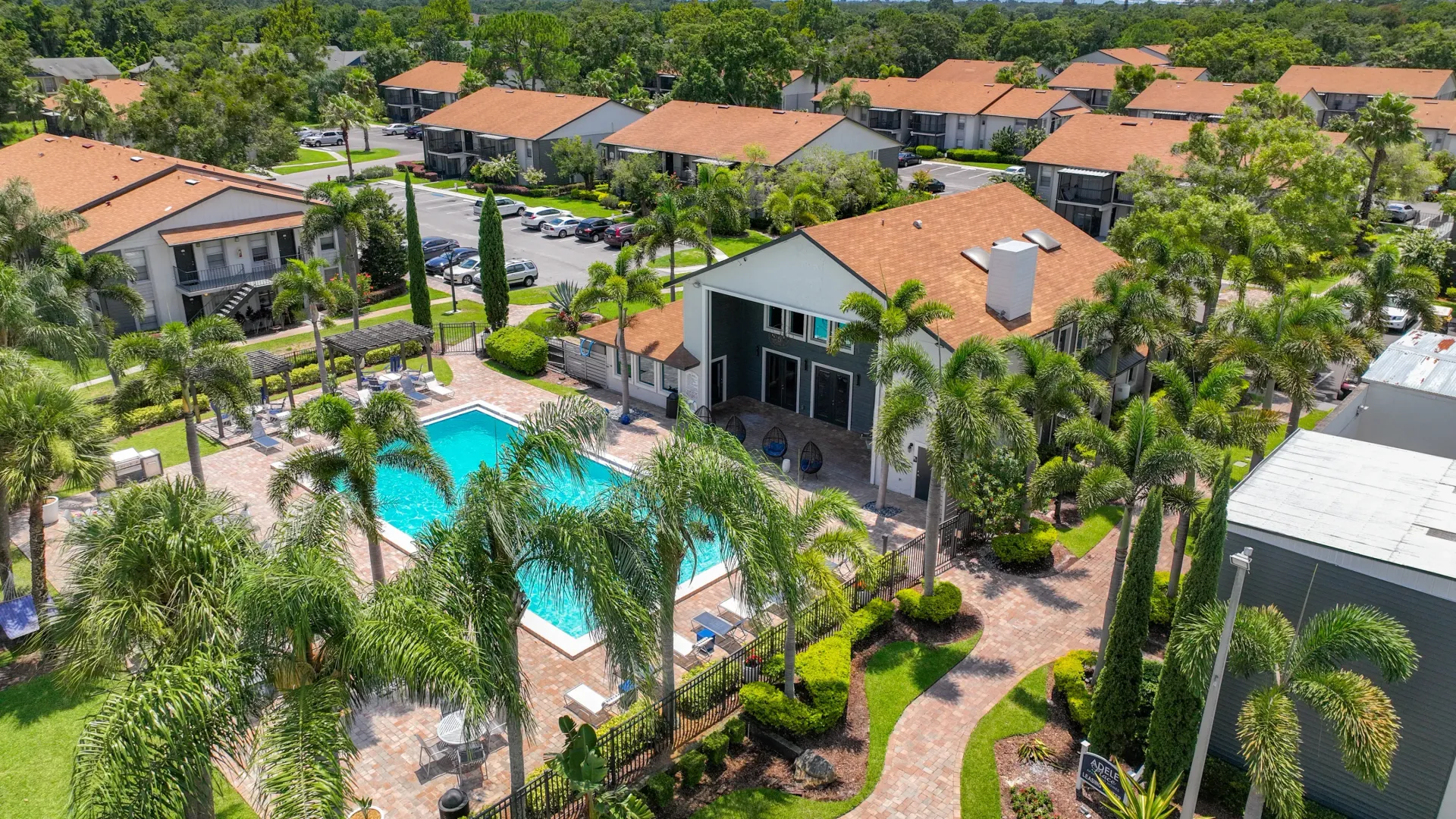 An aerial perspective of the apartment community, with the resort-style pool featured at the center.