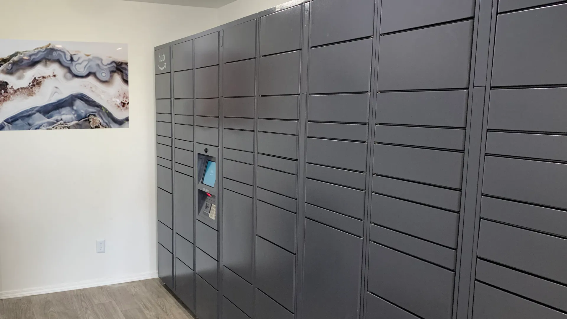 An Amazon Hub Locker, a secure and convenient package delivery system for residents, providing a seamless experience for package pickups and drop-offs.