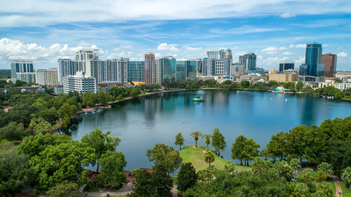 A view of the buildings in Orlando from across Lake Eola.