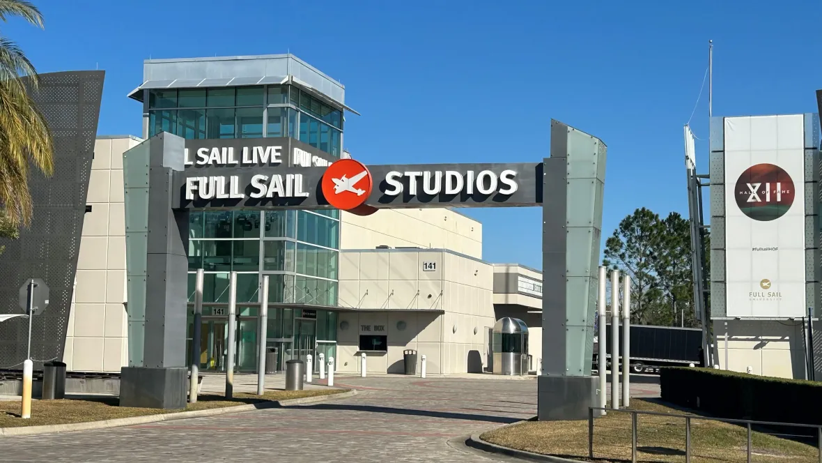 An image of the iconic Full Sail campus entry, framed by its renowned arch, beckoning you into an expansive 212-acre campus, where the magic of learning unfolds.