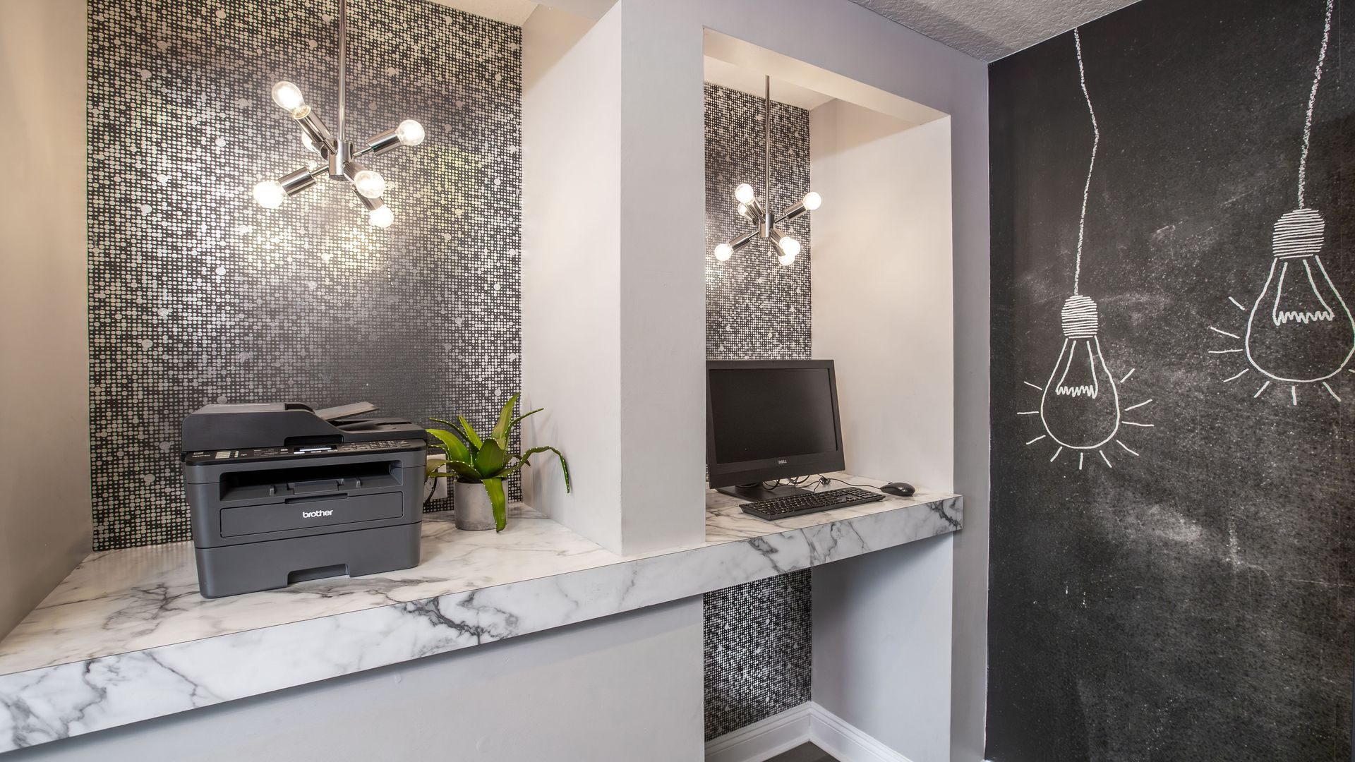 Modern business center with desktop computer and printer inside Harper Grand Apartments in Orlando.