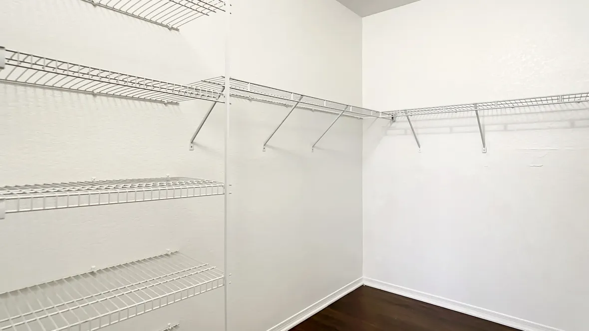 The closet of your dreams offering spaciousness and organization to meet all your wardrobe desires.