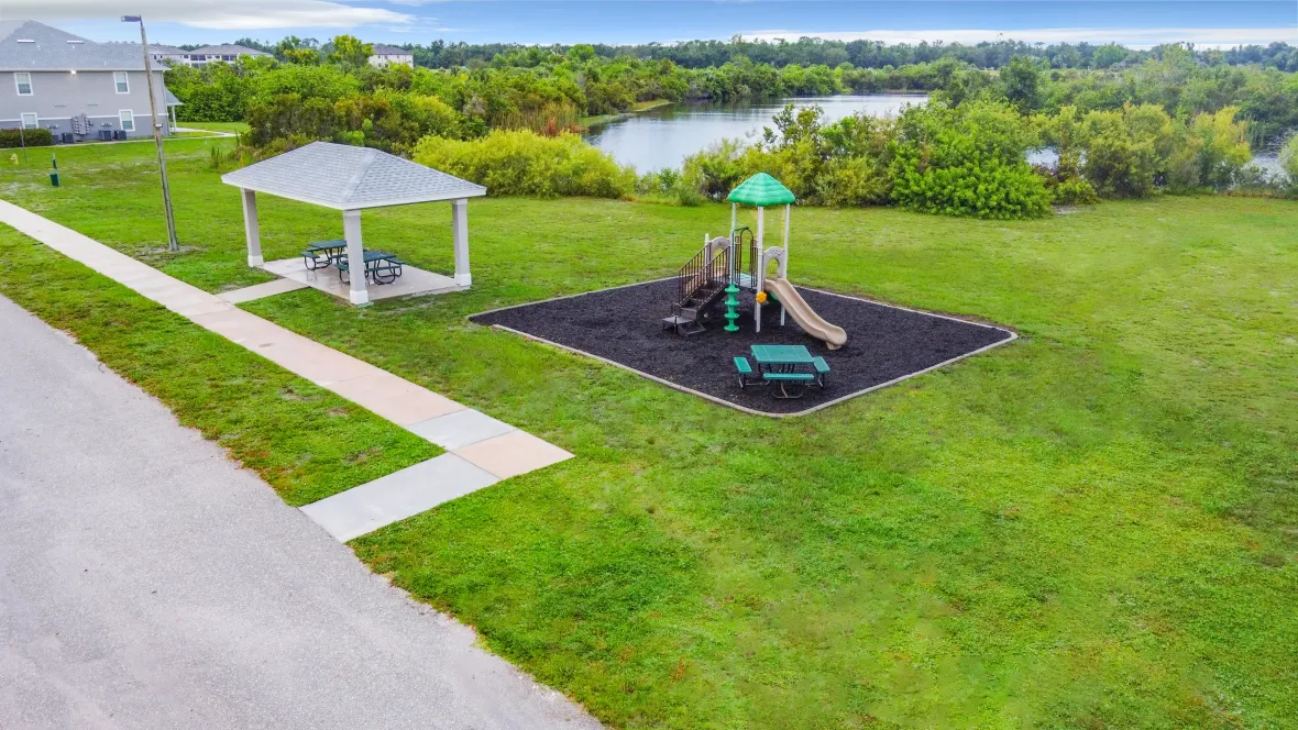 Charleston Cay's charming and meticulously maintained playground and picnic area grounds, inviting children and families to relish outdoor fun and togetherness in their own backyard.