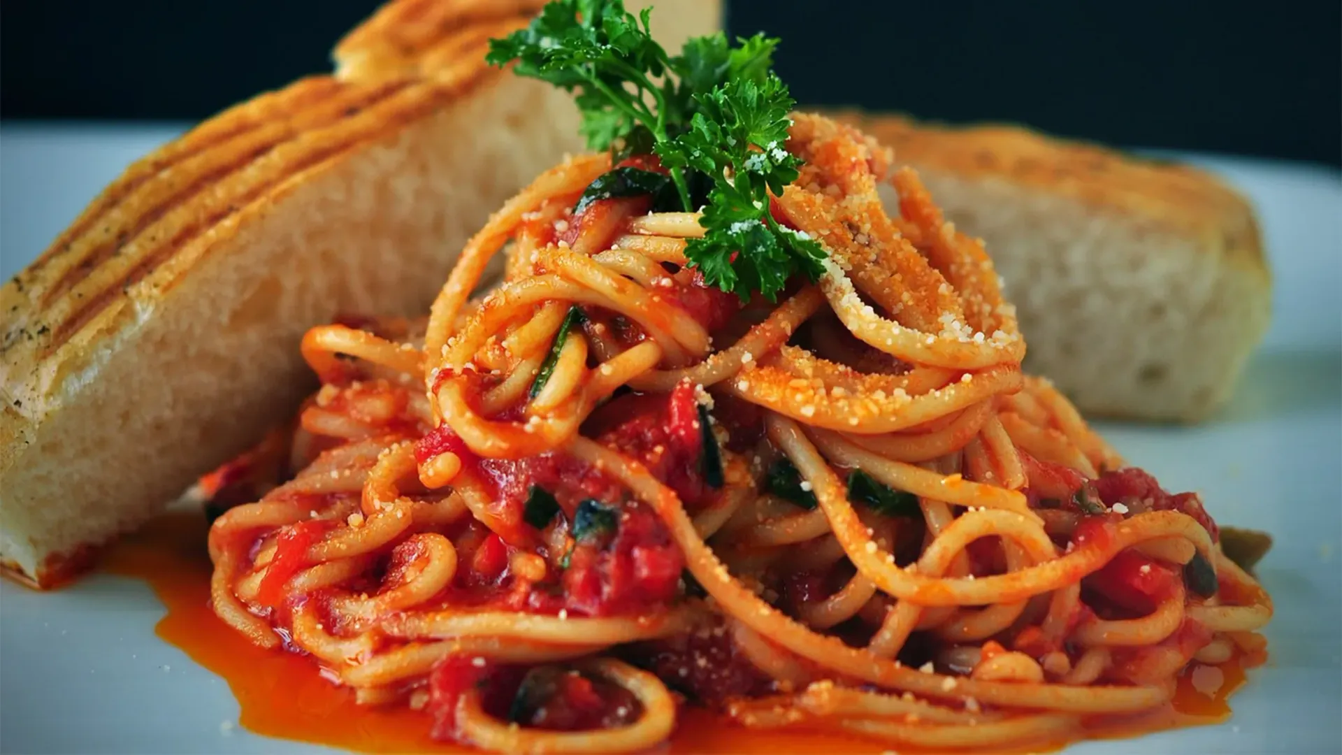 A plate of spaghetti on a restaurant table